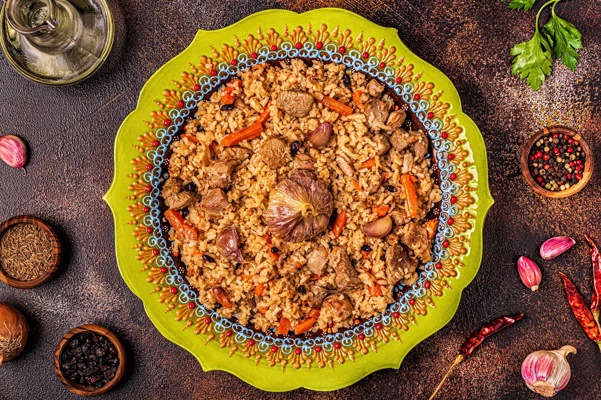 Pilaf with meat, vegetables and spices, top view.